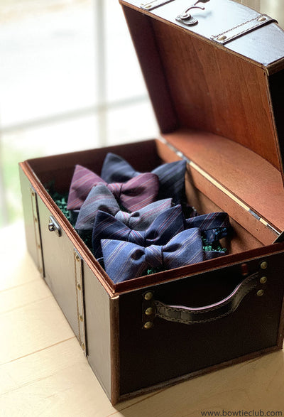 woven black bow tie in chest