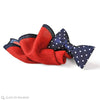 a perfect pairing of navy polka bow tie and red wool pocket square